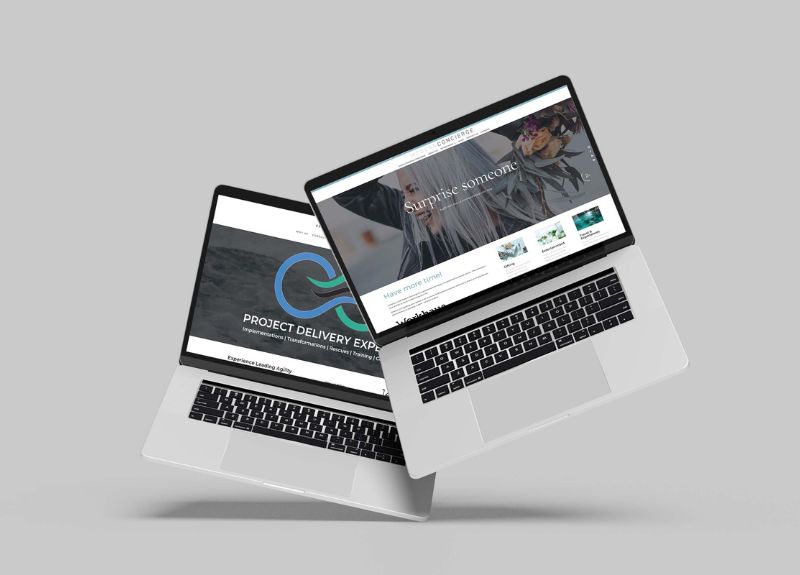 AI-Powered Website Design Showcase A modern, professional display of two MacBooks showcasing AI-powered website designs, highlighting sleek, user-friendly, and visually appealing web layouts.